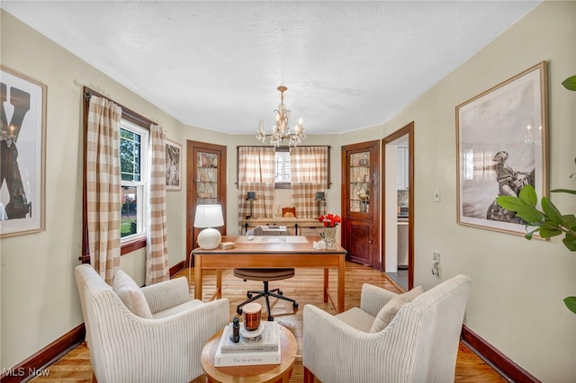 14914 Tudor Ave, Cleveland, OH 44111 - office space featuring a chandelier and light wood-style flooring