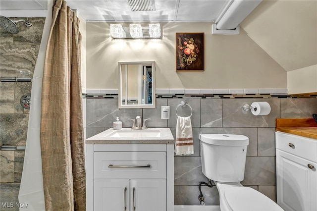 14914 Tudor Ave, Cleveland, OH 44111 - full bathroom featuring tile walls, vanity, a tile shower, and a wainscoted wall
