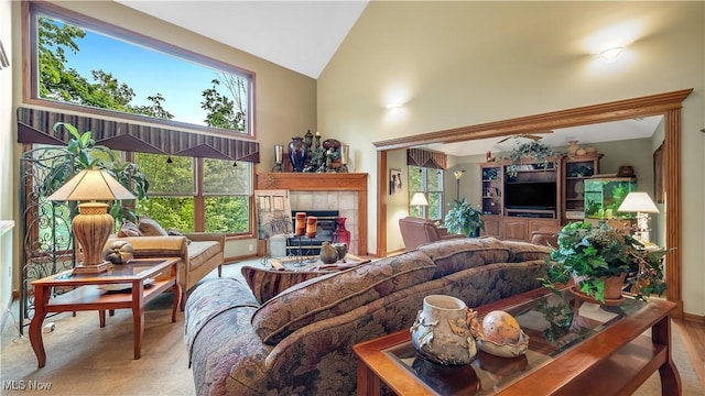 14751 Lancelot Ln E, North Royalton, OH 44133 - living room featuring high vaulted ceiling, plenty of natural light, a tile fireplace, and carpet