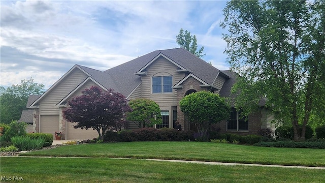 14751 Lancelot Ln E, North Royalton, OH 44133 - view of front of house with brick siding and a front lawn