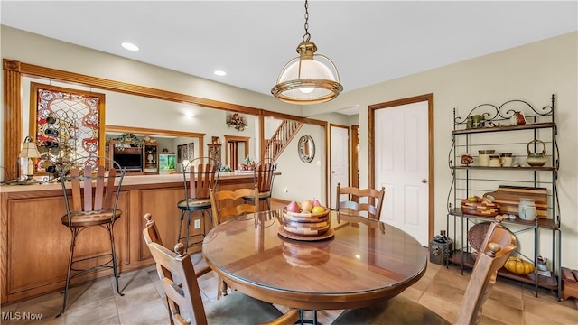 14751 Lancelot Ln E, North Royalton, OH 44133 - dining space featuring light tile patterned flooring, stairway, and recessed lighting