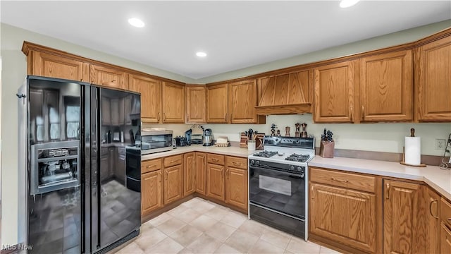 14751 Lancelot Ln E, North Royalton, OH 44133 - kitchen with black refrigerator with ice dispenser, gas stove, custom range hood, brown cabinets, and recessed lighting