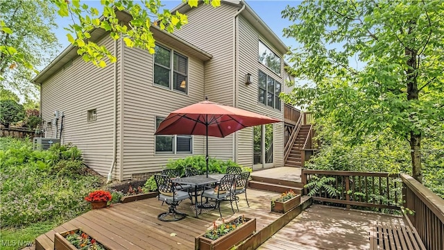 14751 Lancelot Ln E, North Royalton, OH 44133 - deck featuring outdoor dining area and stairway