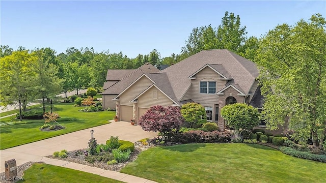 14751 Lancelot Ln E, North Royalton, OH 44133 - view of front of house with a front lawn, driveway, an attached garage, and a shingled roof
