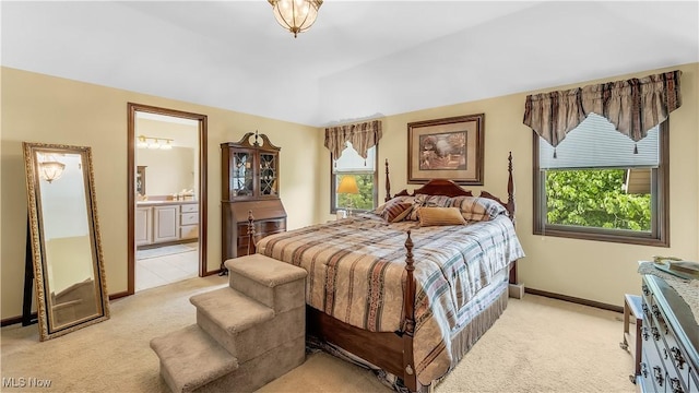 14751 Lancelot Ln E, North Royalton, OH 44133 - bedroom with light colored carpet and ensuite bathroom