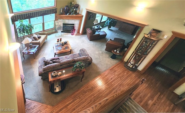 14751 Lancelot Ln E, North Royalton, OH 44133 - carpeted living area with a tiled fireplace and wood finished floors