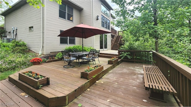 14751 Lancelot Ln E, North Royalton, OH 44133 - deck with outdoor dining area and stairway