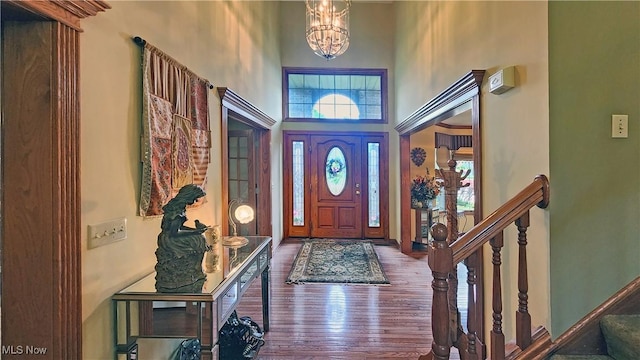 14751 Lancelot Ln E, North Royalton, OH 44133 - entrance foyer with a high ceiling, wood finished floors, stairway, and a chandelier