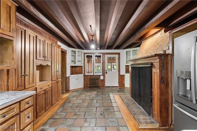 2132 Martin Rd, Mogadore, OH 44260 - kitchen with stainless steel fridge with ice dispenser, stone tile flooring, light countertops, a fireplace, and radiator