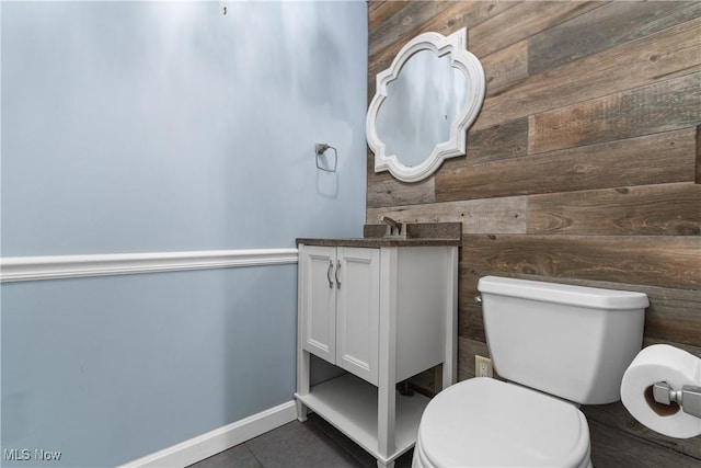 2132 Martin Rd, Mogadore, OH 44260 - half bathroom featuring vanity, wood walls, and tile patterned floors