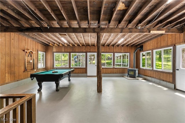 2132 Martin Rd, Mogadore, OH 44260 - recreation room featuring finished concrete flooring, healthy amount of natural light, a wood stove, billiards table, and wood walls