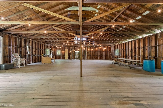 2132 Martin Rd, Mogadore, OH 44260 - miscellaneous room with wood-type flooring, lofted ceiling, and a chandelier