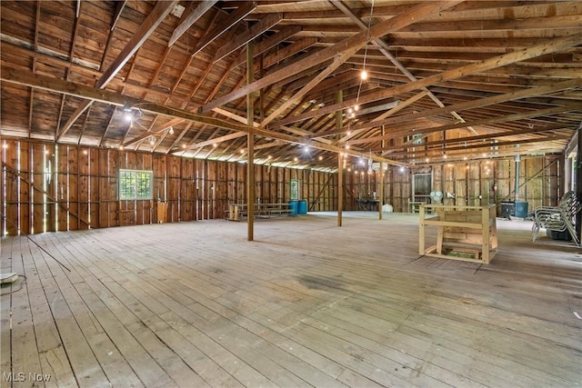 2132 Martin Rd, Mogadore, OH 44260 - miscellaneous room featuring wood-type flooring and vaulted ceiling