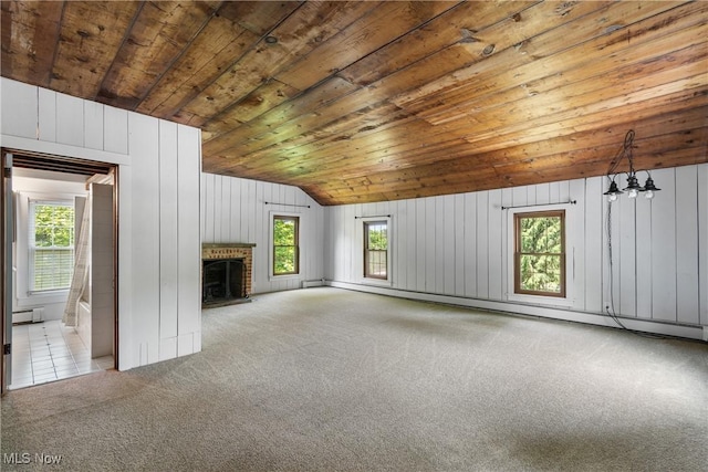 2132 Martin Rd, Mogadore, OH 44260 - unfurnished living room featuring a baseboard heating unit, wooden ceiling, a baseboard radiator, carpet floors, and lofted ceiling