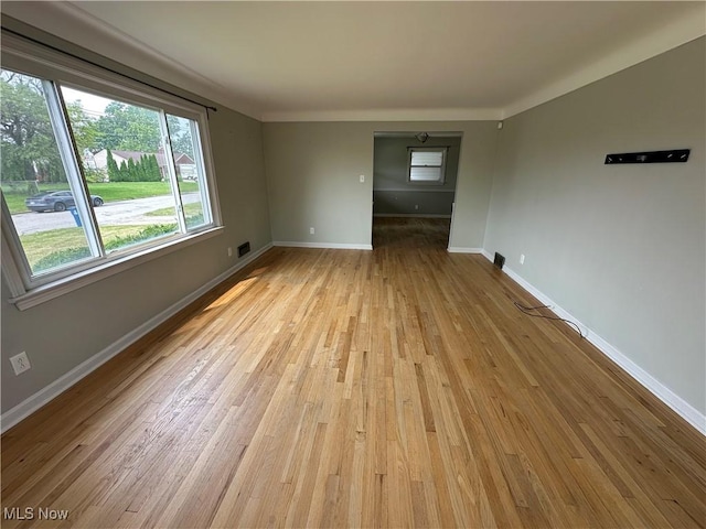 814 Almasy Dr, Campbell, OH 44405 - empty room with light wood finished floors and baseboards