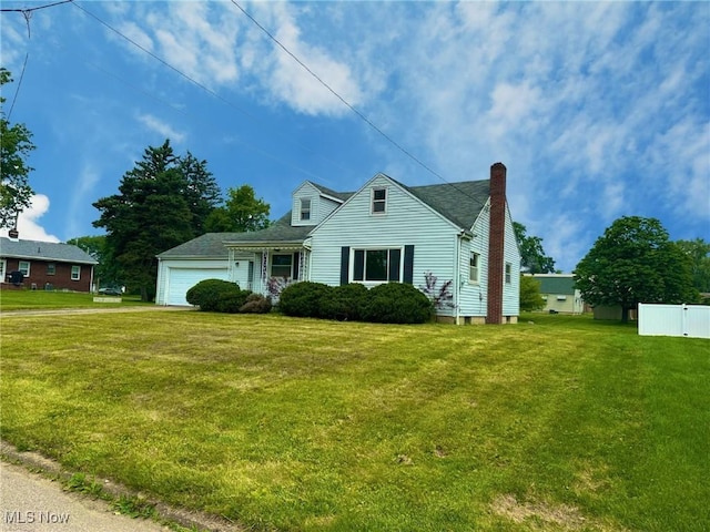 814 Almasy Dr, Campbell, OH 44405 - cape cod-style house with a chimney and a garage