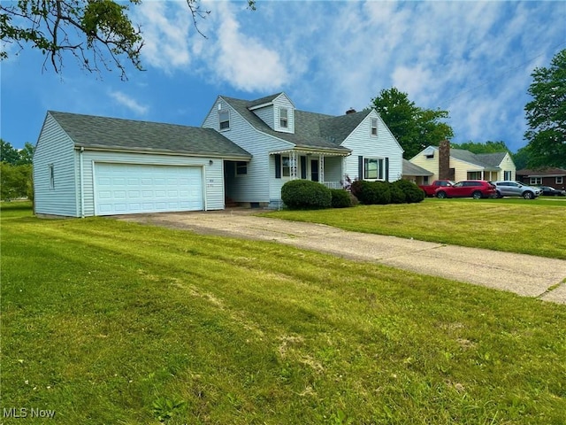 814 Almasy Dr, Campbell, OH 44405 - view of front of home featuring an attached garage, driveway, and a front lawn