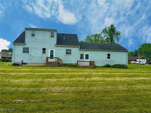 814 Almasy Dr, Campbell, OH 44405 - back of house with a lawn, roof with shingles, and a deck