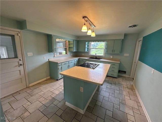 814 Almasy Dr, Campbell, OH 44405 - kitchen with green cabinets, gas cooktop, light countertops, and open shelves
