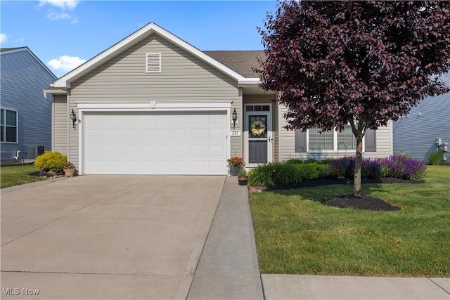 221 Kensington Way, Elyria, OH 44035 - view of front of house featuring concrete driveway, a garage, and a front yard