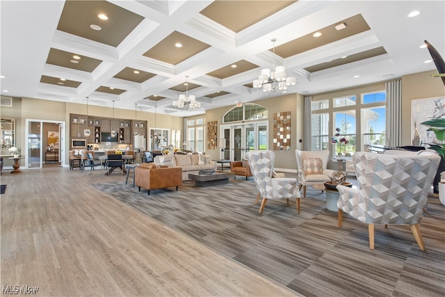221 Kensington Way, Elyria, OH 44035 - carpeted living area with coffered ceiling, a chandelier, beamed ceiling, recessed lighting, and a towering ceiling