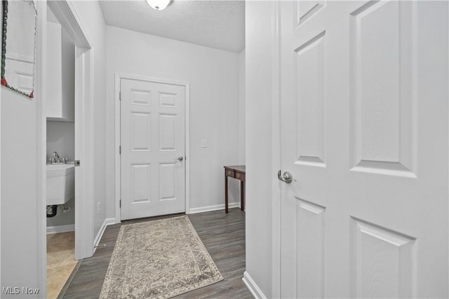 221 Kensington Way, Elyria, OH 44035 - hall with dark wood-style flooring and a textured ceiling