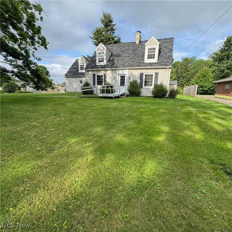 2313 Graustark Path, Wooster, OH 44691 - new england style home with a front lawn and a chimney