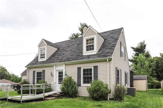 2313 Graustark Path, Wooster, OH 44691 - back of house with a wooden deck, a lawn, a chimney, a shed, and a shingled roof