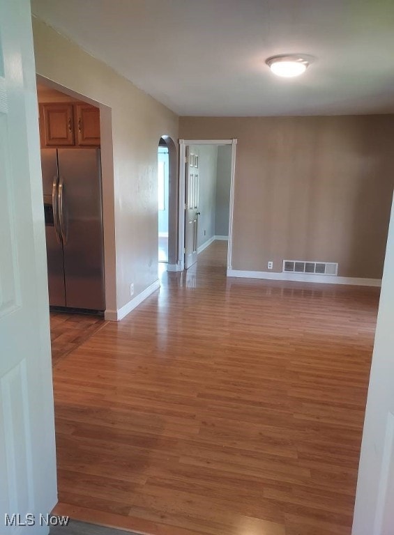 300 37th St, Vienna, WV 26105 - empty room featuring light wood-type flooring and arched walkways