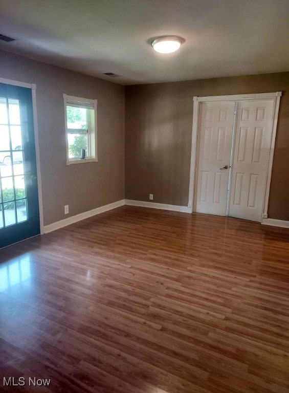 300 37th St, Vienna, WV 26105 - unfurnished bedroom with dark wood-type flooring