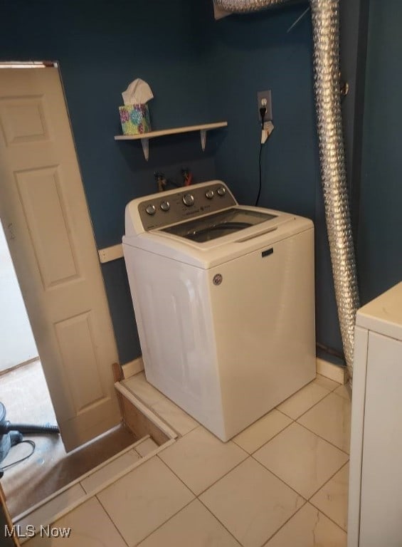 300 37th St, Vienna, WV 26105 - washroom with washer / clothes dryer and light tile patterned flooring