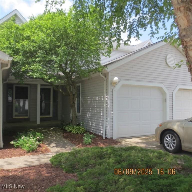 696 Crownwood Ct, Streetsboro, OH 44241 - view of front of home with a garage