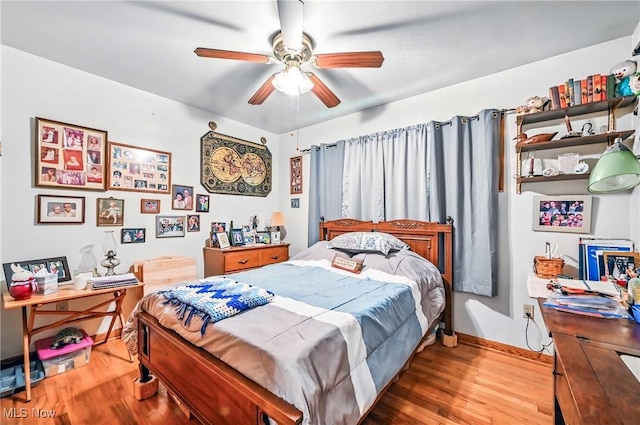 14860 Stoltz Rd, Diamond, OH 44412 - bedroom with wood finished floors and a ceiling fan