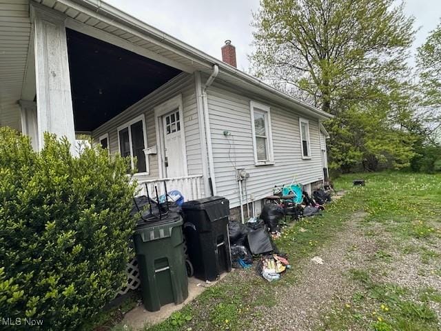 6108 Gateway Blvd S, Elyria, OH 44035 - view of home's exterior with a chimney