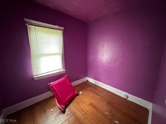 6108 Gateway Blvd S, Elyria, OH 44035 - spare room featuring baseboards and wood finished floors