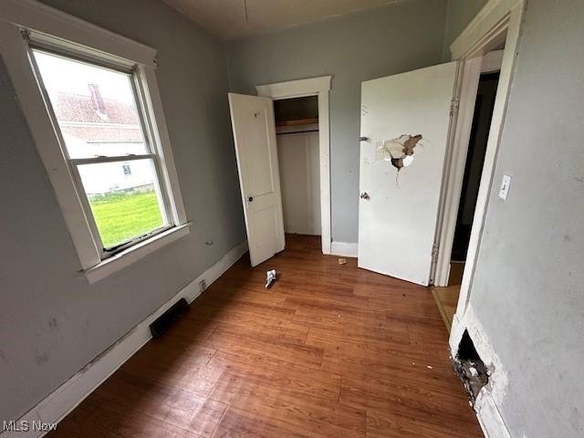 6108 Gateway Blvd S, Elyria, OH 44035 - unfurnished bedroom with wood finished floors and a closet