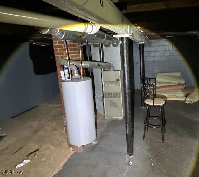 6108 Gateway Blvd S, Elyria, OH 44035 - unfinished basement featuring water heater, concrete block wall, and heating unit