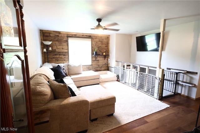 148 Summerberry Ln, Niles, OH 44446 - living area featuring ceiling fan, wooden walls, plenty of natural light, and wood finished floors