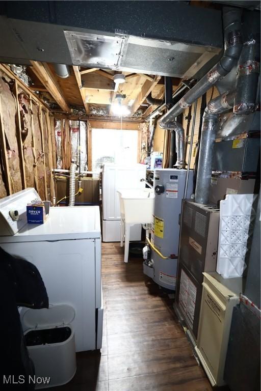 148 Summerberry Ln, Niles, OH 44446 - basement featuring washer and dryer, water heater, and wood finished floors