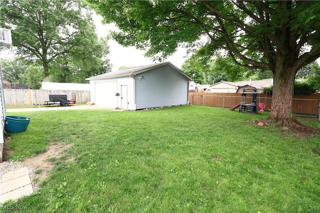148 Summerberry Ln, Niles, OH 44446 - fenced backyard featuring a garage and an outbuilding