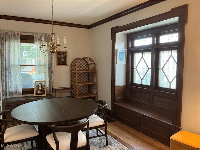 136 High St SE, Canal Fulton, OH 44614 - dining space featuring wood finished floors, ornamental molding, and a chandelier