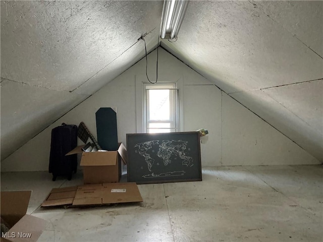 136 High St SE, Canal Fulton, OH 44614 - additional living space with vaulted ceiling and a textured ceiling