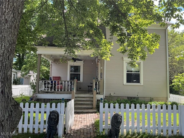 136 High St SE, Canal Fulton, OH 44614 - obstructed view of property with covered porch
