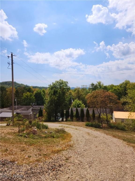 23516 Hideaway Dr, Senecaville, OH 43780 - view of dirt / gravel road