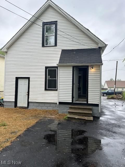 8910 Harris Ave, Cleveland, OH 44104 - back of house featuring entry steps