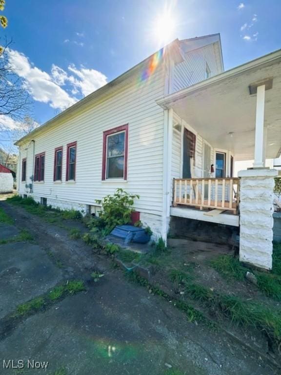 8910 Harris Ave, Cleveland, OH 44104 - view of home's exterior featuring a porch