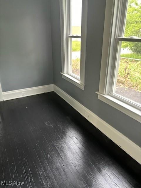 8910 Harris Ave, Cleveland, OH 44104 - empty room with dark wood-style floors