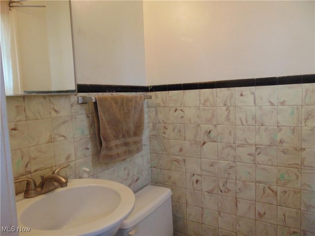 4017 N Ridge Rd W, Saybrook, OH 44004 - bathroom with tile walls and wainscoting