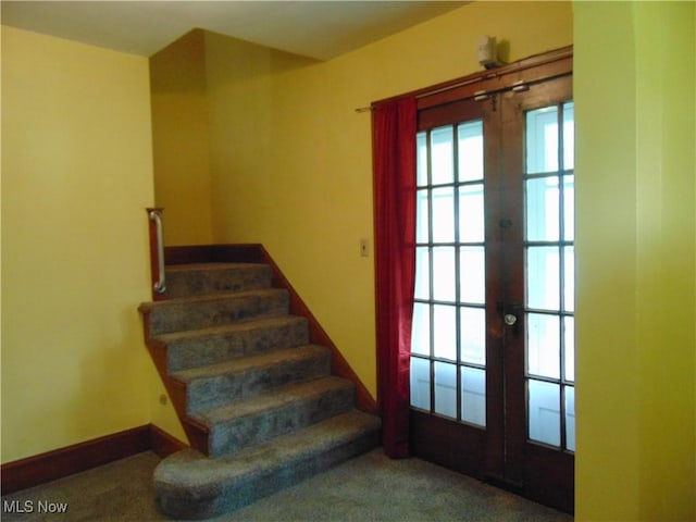 4017 N Ridge Rd W, Saybrook, OH 44004 - stairway with french doors and baseboards