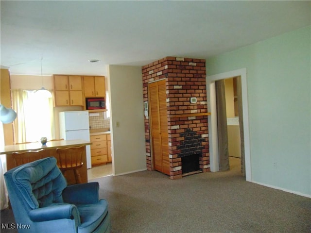 4017 N Ridge Rd W, Saybrook, OH 44004 - living room with light colored carpet and a brick fireplace
